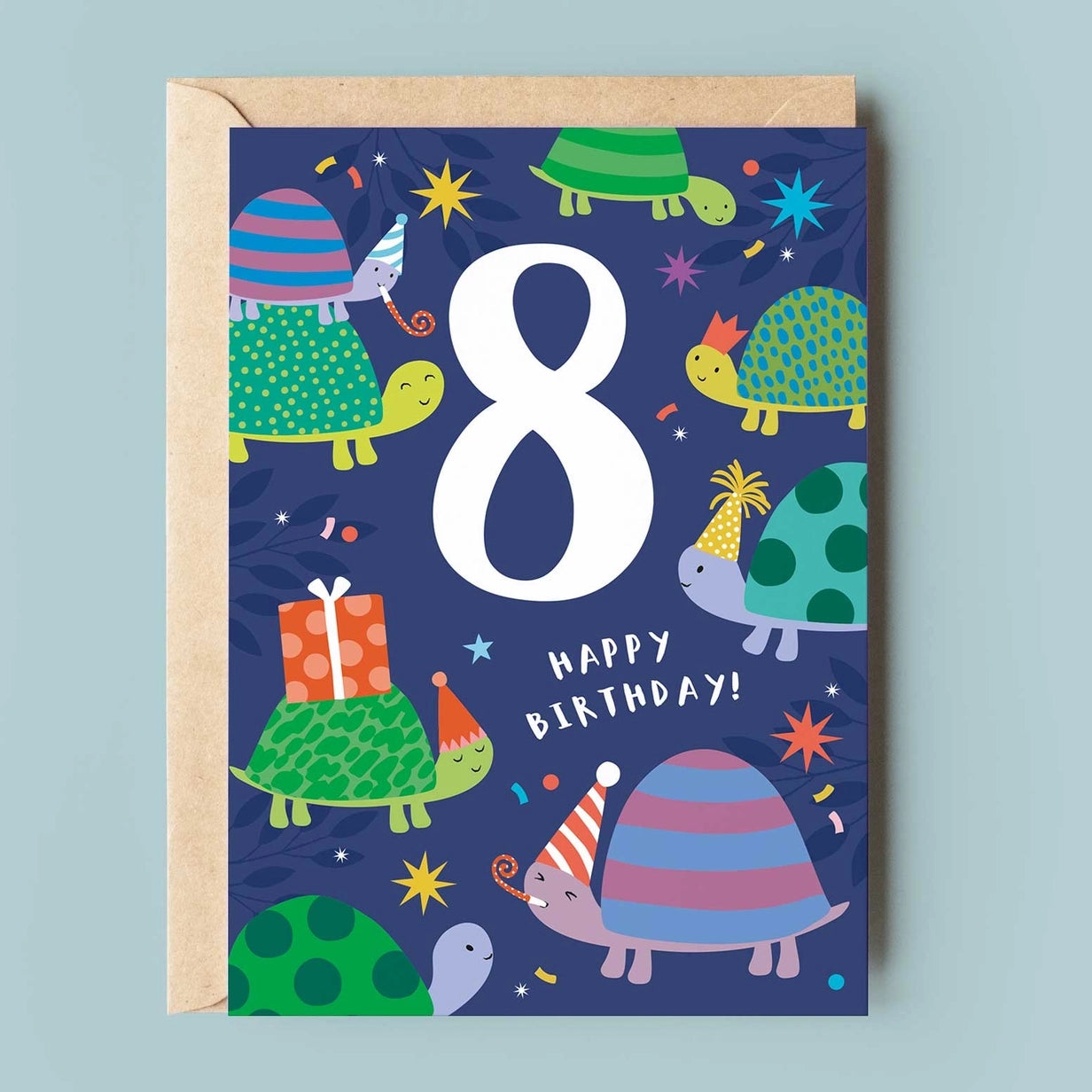 Greeting card featuring illustrations of smiling turtles wearing party hats while one turtle blows a party blower. The text '8' and 'Happy Birthday' are printed on a blue background along with the illustrations. 