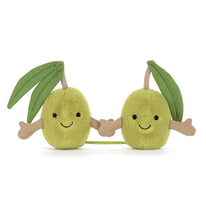 Two green Jellycat olive plushes with smiling faces holding hands on a white background.