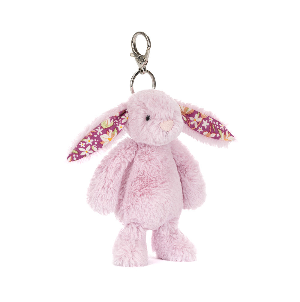 Jellycat lilac bunny keychain with floral ears on a white background.