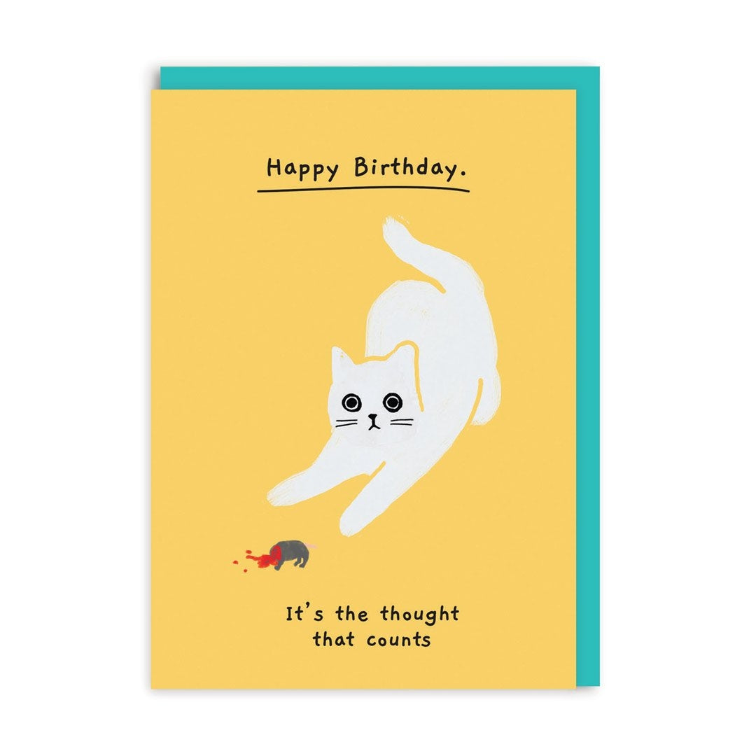 Greeting card with an illustration of a white cat with a dead mouse and humorous text saying "Happy Birthday. It's the thought that counts" on a yellow background.