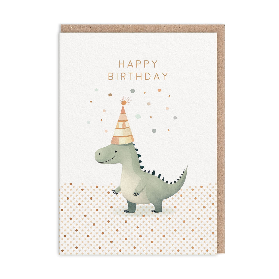Greeting card with a dinosaur wearing a party hat on a white background with gold polka dots. The card has text saying "Happy Birthday".