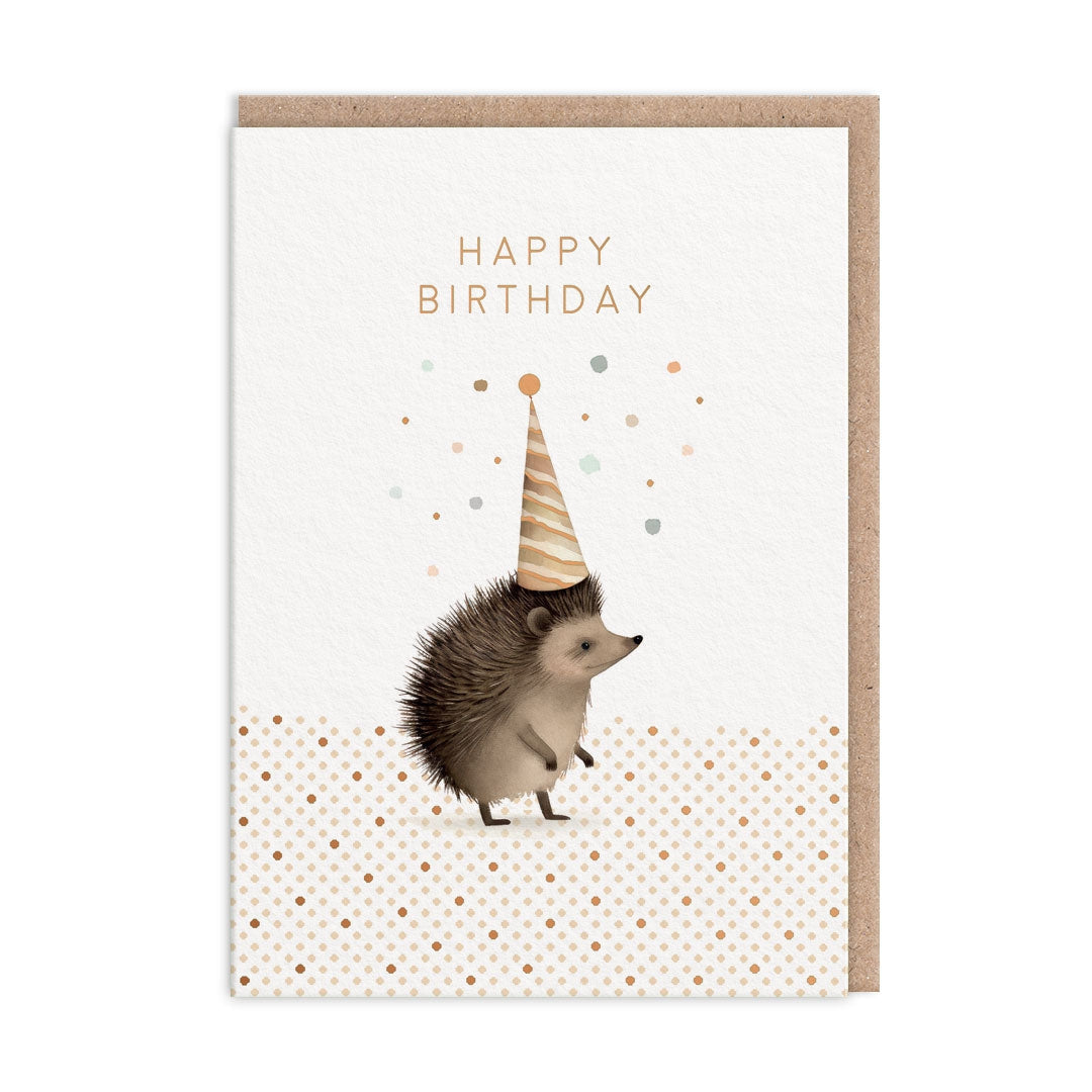 Greeting card with a hedgehog wearing a party hat on a white background with gold polka dots with the text "Happy Birthday".