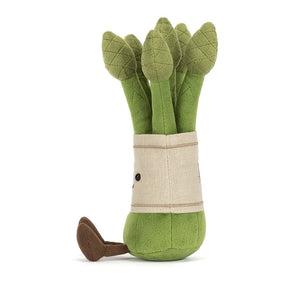 Side view of a Jellycat asparagus plush toy on a white background