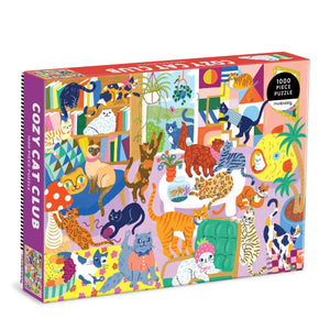 Puzzle box with colorful illustrations of cats in a living room setting in various positions. 