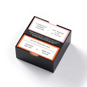 A box containing a deck of trivia cards on a white background. 