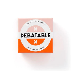 The image shows the packaging of the Debatable Game. The box is predominantly white with orange accents, and it has the product name 'Debatable' displayed on it.
