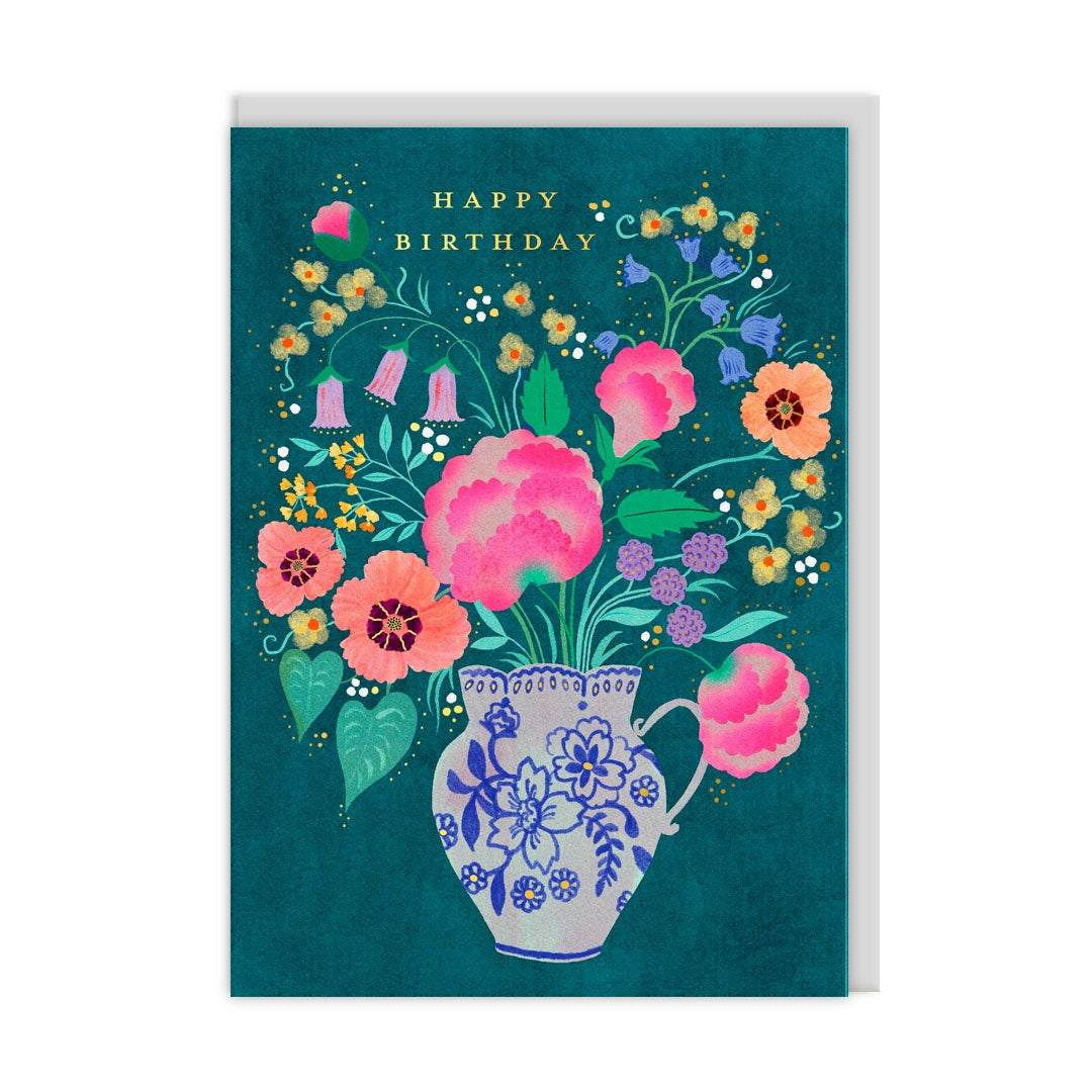 Birthday card with an illustration of a vase filled with flowers and 'Happy Birthday' text on a teal background.