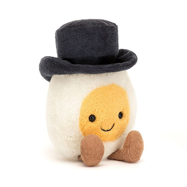 adorably soft plushie of a smiling boiled egg with a top hat and legs by popular brand Jellycat.