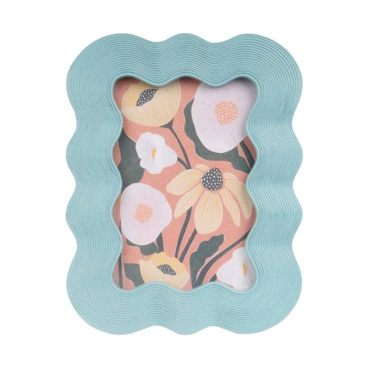 A blue rectangular shaped photo frame with a wavy texture and design around the border. A floral image sits within the frame. 