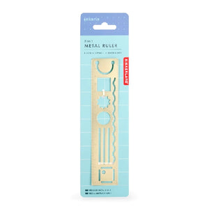 golden metal ruler on a blue hangable product band. the ruler has several stencils inside itincluding square, circle, lines, wavy line, and more. kikkerland product on white background