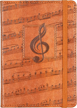 Brown leather style notebook with embossed music-themed design featuring a treble clef.
