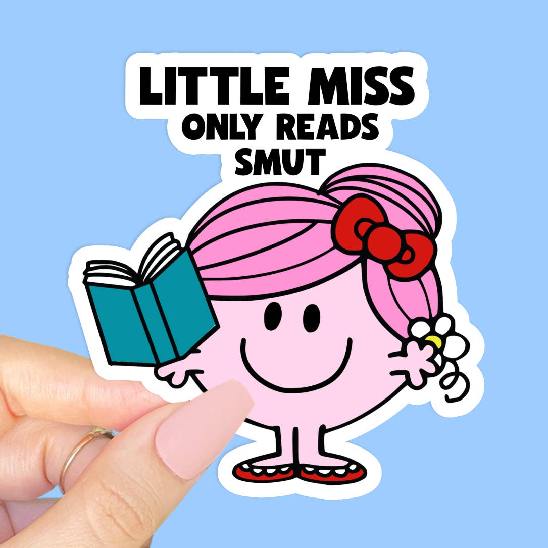 A sticker featuring an illustration of a pink, smiling Little Miss character. She wears a red bow and a flower in her hair and red shoes, while holding a book in one hand. The text 'LIttle Miss Only Reads Smut' is printed over the image. 