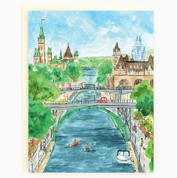 A blank art card featuring a colourful illustration of Ottawa's Rideau Canal with people boating, a bridge, and Parliament building in the background. 