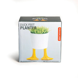 kkikerland product box on a white background. a standing planter with sample plants and duck feet is pictured on the box. top left side text reads "duck feet planter"