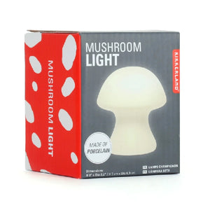 grey package box on white background. pictured on box is an off-white light in a small mushroom shape. main texts read "mushroom light" and "made of porcelain". kikkerland product