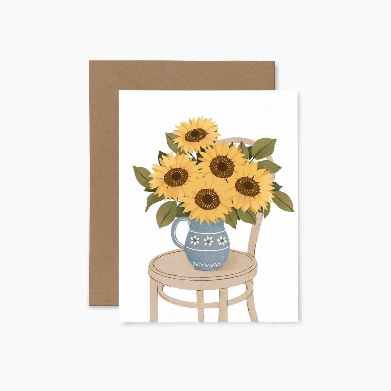 Greeting card featuring an illustration of a blue vase filled with sunflowers sitting on top of a brown chair on a white background.