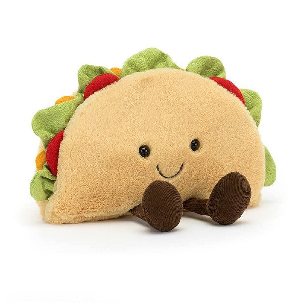 adorably soft plushie of a smiling taco with legs by popular brand Jellycat.