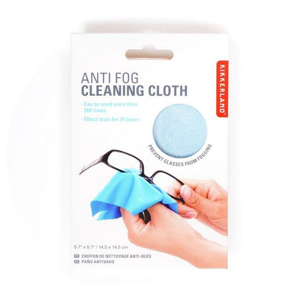 white product box with a small circular window revealing material of the light blue cloth inside. main text reads "anti fog cleaning cloth". kikkerland product on white background