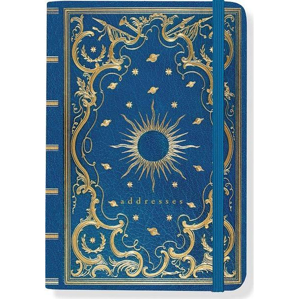 royal blue leather journal with intricate gold details such as planets and a sun in the centre. bottom text reads "addresses" in gold. an elastic band clasps the book vertically