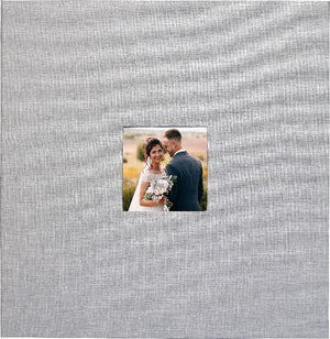 grey material square photo album cover with a tiny square stock wedding picture in the centre