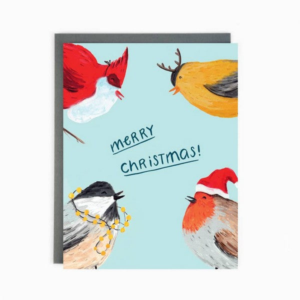 A colorful Christmas card featuring illustrations of birds wearing festive hats and decorations on a blue background with the text 'Merry Christmas!'.