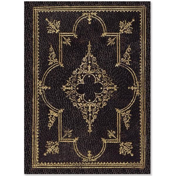 dark brown textured notebook with intricate gold details on the cover