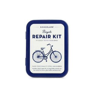 white metal box with a blue banner. an illustration of a bicycle viewed from the side in the centre of the lid. top text reads "bicycle repair kit it's easy to fix your bike!". more text written below the illustration. kikkerland product on white background