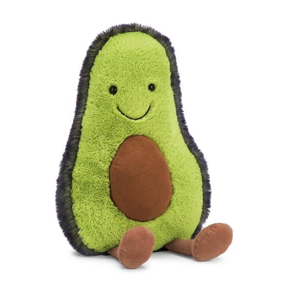 adorably soft plushie of a smiling avocado with pit and legs by popular brand Jellycat.