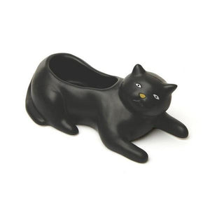 black cat planter starring into the void. kukkerland product on white background