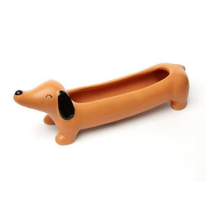 long, smiling dachshund planter on a white background. kikkerland product