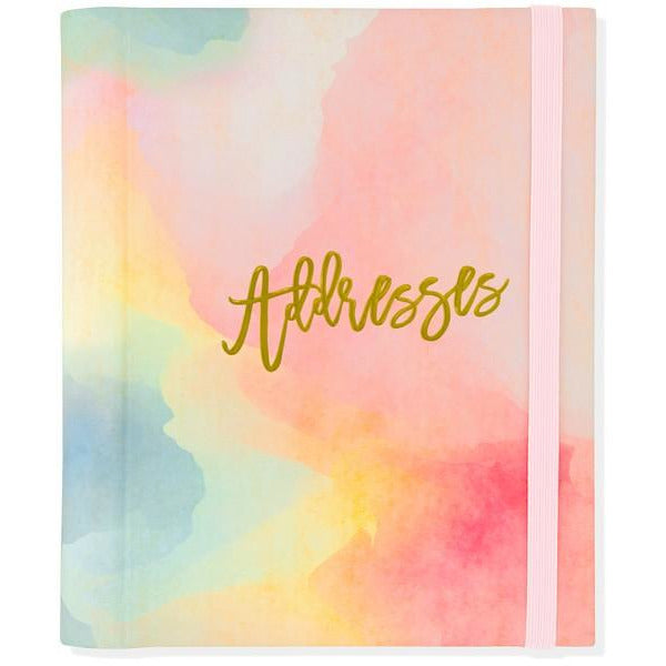 pastel watercolour address book with a baby pink elastic. middle right text reads "addresses" in cursive golden font